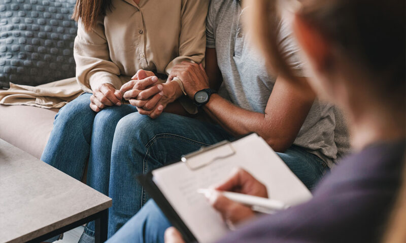 Couple undergoing family planning counseling session.